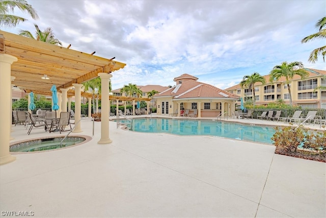 view of pool with a patio area, a pergola, and a hot tub