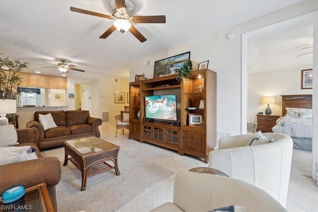 tiled living room featuring ceiling fan