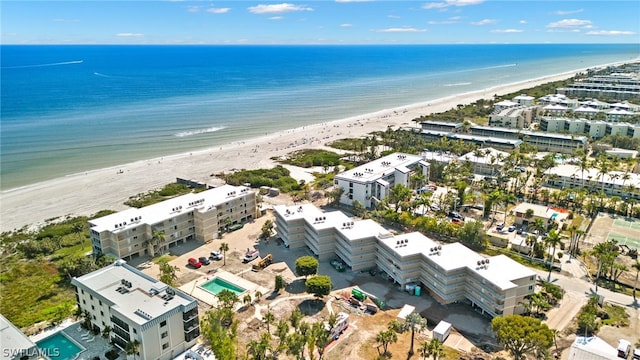 drone / aerial view featuring a view of the beach and a water view