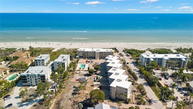 bird's eye view with a water view and a view of the beach