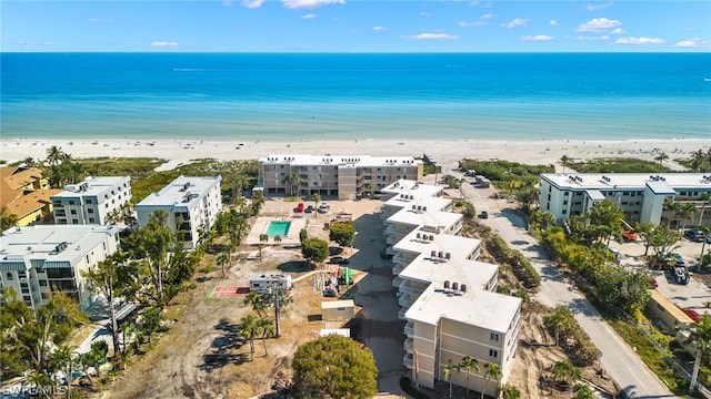 aerial view featuring a water view and a beach view