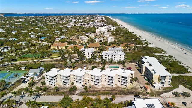 bird's eye view featuring a water view and a view of the beach