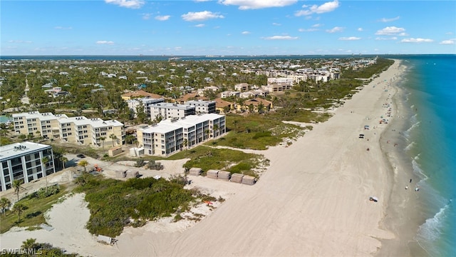 bird's eye view featuring a beach view and a water view