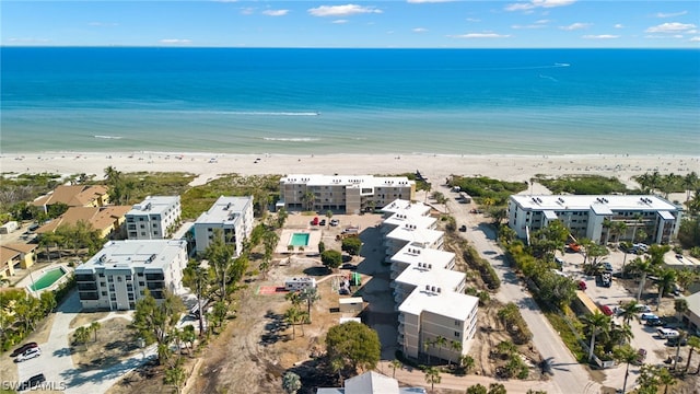 aerial view with a water view and a view of the beach