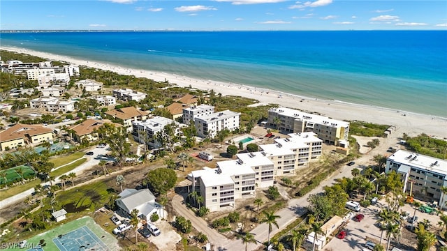 aerial view with a water view and a view of the beach