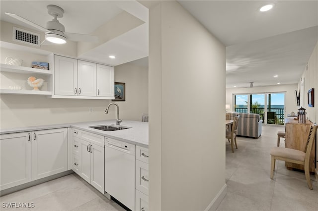 kitchen with ceiling fan, dishwasher, sink, and white cabinets