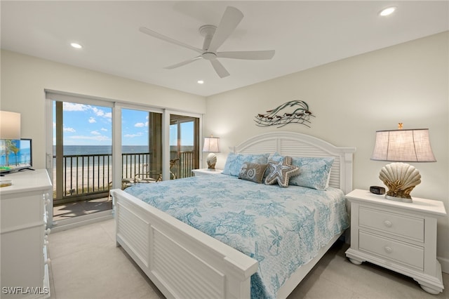 bedroom with a water view, access to outside, and ceiling fan