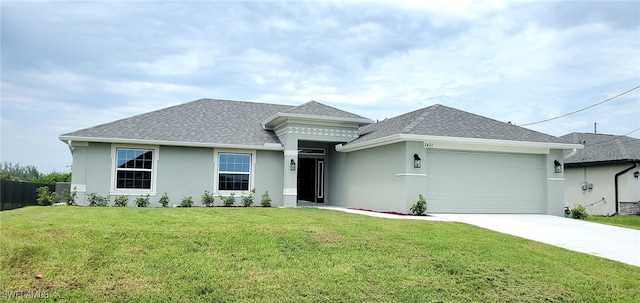 view of front of house featuring a garage and a front yard