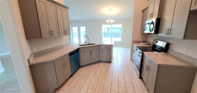 kitchen with gray cabinets, pendant lighting, appliances with stainless steel finishes, and sink