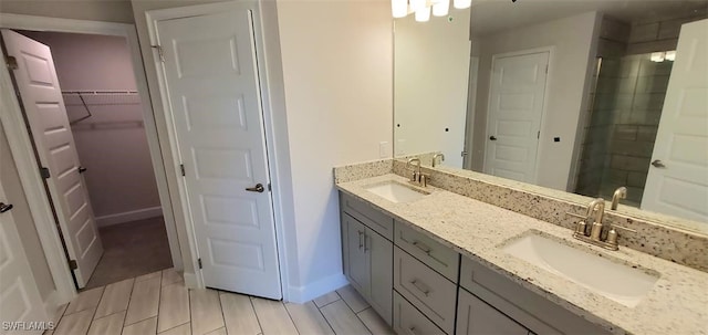 bathroom with dual vanity and tile patterned floors