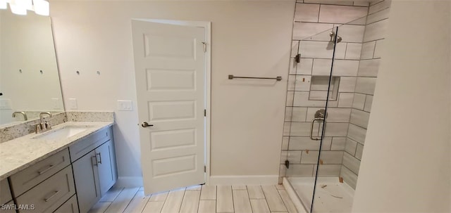 bathroom featuring vanity, tile patterned flooring, and walk in shower