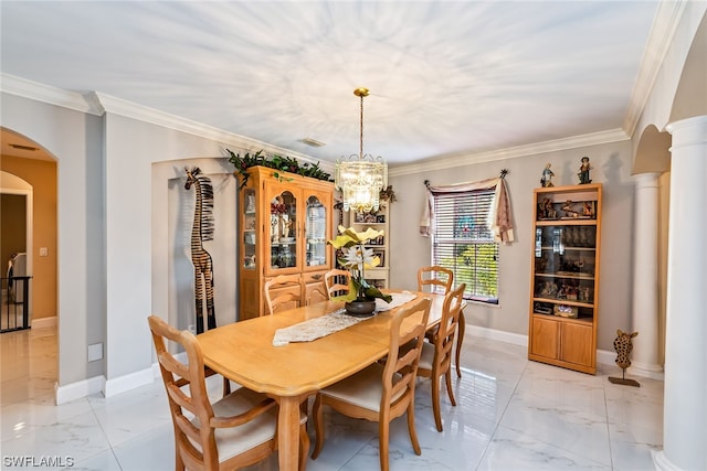 dining space with an inviting chandelier, decorative columns, ornamental molding, and light tile floors