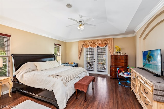 bedroom featuring access to exterior, a raised ceiling, french doors, and dark hardwood / wood-style flooring