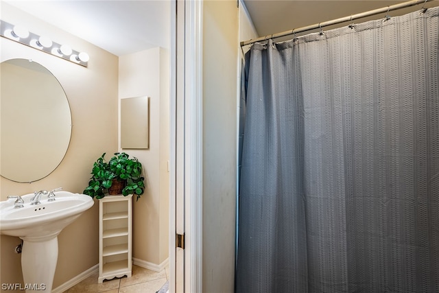 bathroom featuring tile flooring