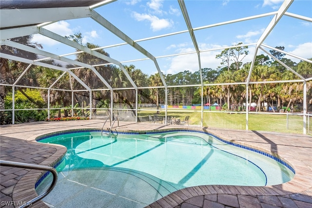 view of pool with a patio and a lanai