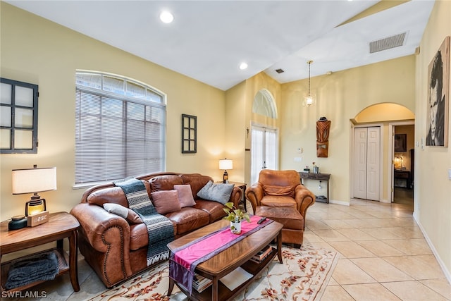 tiled living room with a healthy amount of sunlight