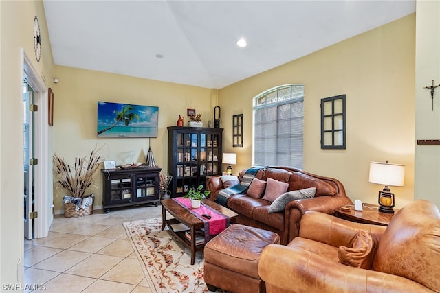 tiled living room featuring lofted ceiling