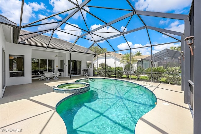 view of pool with ceiling fan, a lanai, a patio, and an in ground hot tub