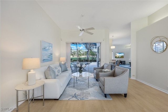 living room featuring light wood-type flooring and ceiling fan