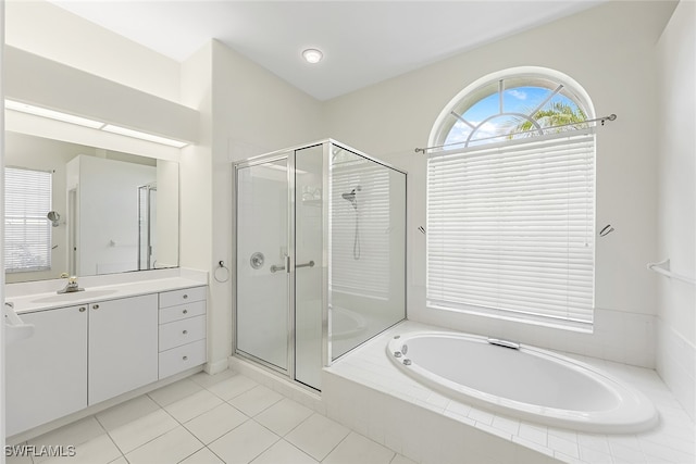 bathroom featuring tile patterned floors, vanity, and plus walk in shower