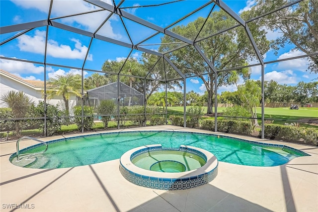 view of pool with a lanai and an in ground hot tub