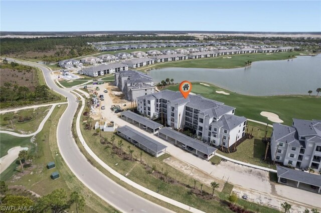 aerial view with view of golf course and a water view