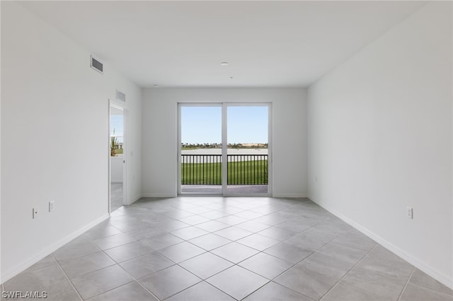 view of tiled spare room