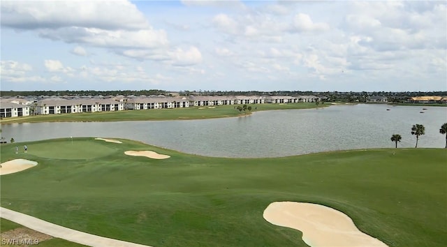 surrounding community featuring a water view