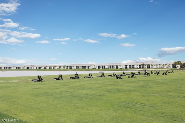 view of nearby features featuring a lawn and an outdoor fire pit