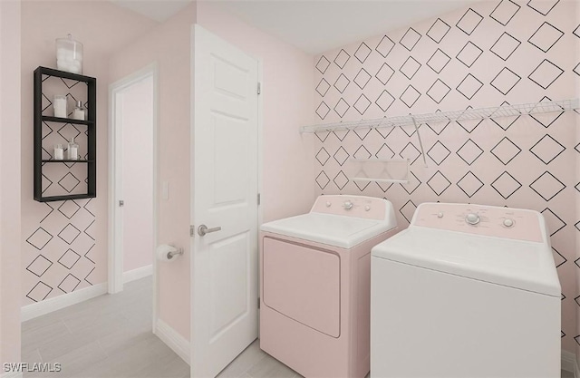 laundry room featuring tile walls, washing machine and clothes dryer, and laundry area