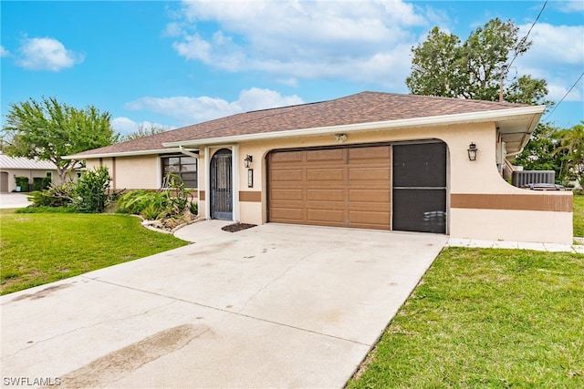 single story home featuring central AC unit, a front yard, and a garage