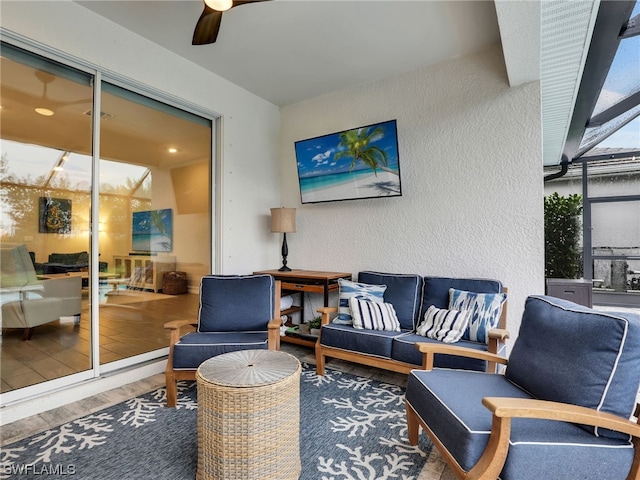 view of patio with an outdoor living space and ceiling fan