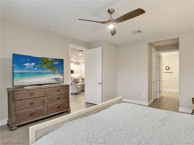 bedroom with connected bathroom and ceiling fan