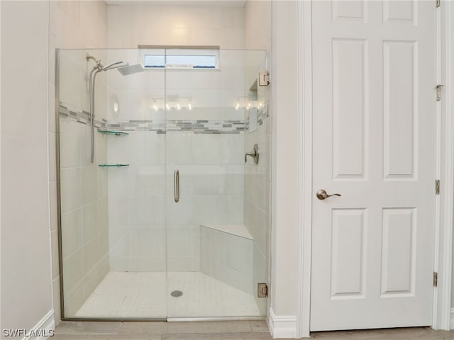 bathroom featuring an enclosed shower