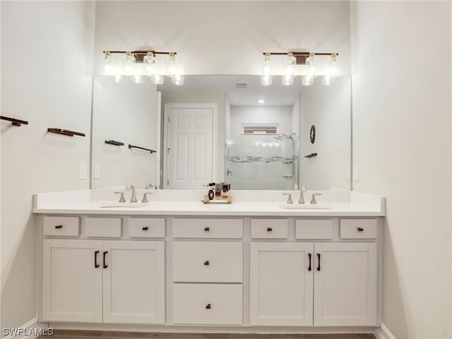 bathroom with vanity and an enclosed shower