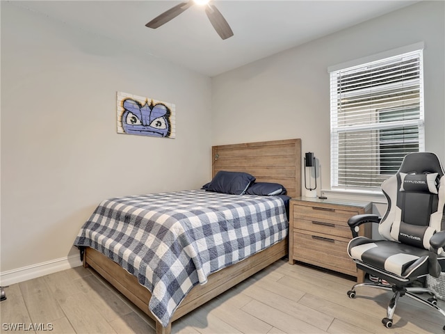 bedroom featuring ceiling fan and light hardwood / wood-style flooring