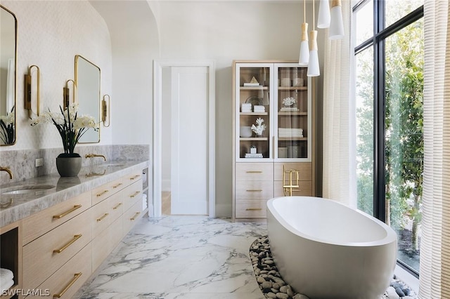 bathroom featuring a bathing tub and vanity