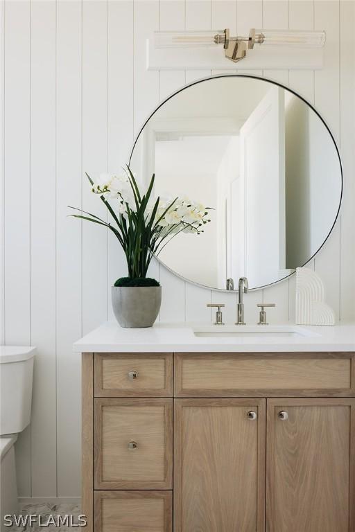 bathroom featuring vanity and toilet