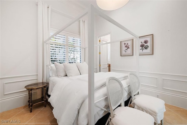 bedroom featuring light tile patterned floors