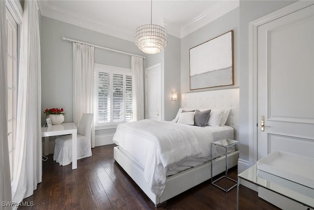 bedroom with a chandelier, dark hardwood / wood-style flooring, and ornamental molding