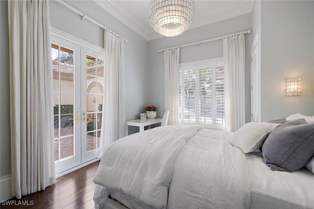 bedroom featuring access to exterior, crown molding, french doors, and dark hardwood / wood-style floors