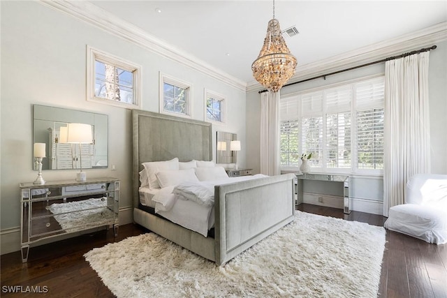 bedroom featuring crown molding, dark hardwood / wood-style flooring, and a notable chandelier