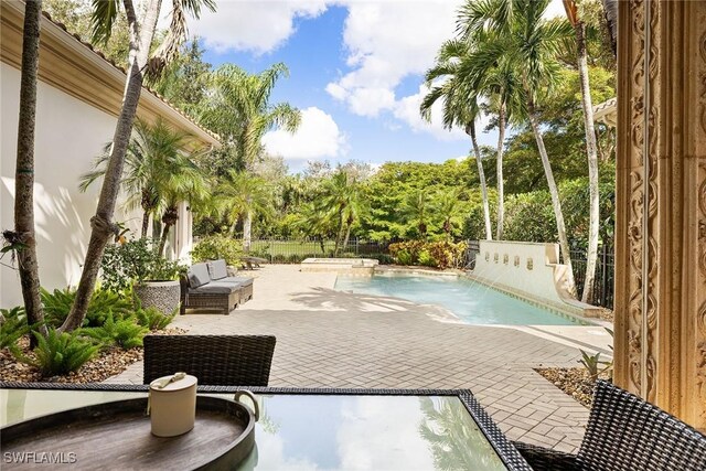 view of pool featuring a patio area and pool water feature