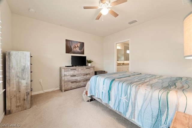 carpeted bedroom featuring connected bathroom and ceiling fan