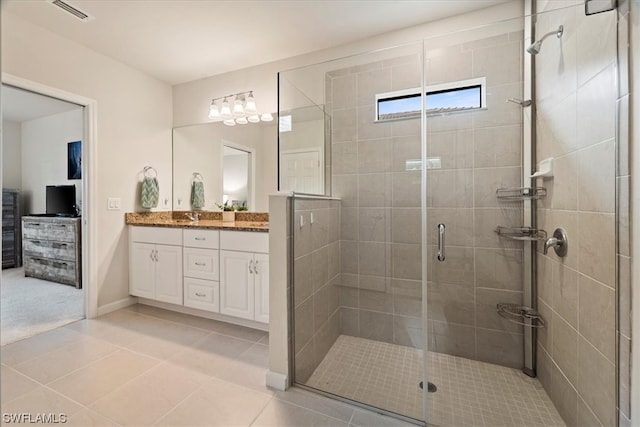 bathroom with double sink, oversized vanity, tile flooring, and a shower with shower door