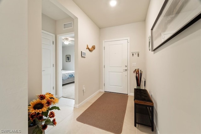 doorway to outside featuring light colored carpet