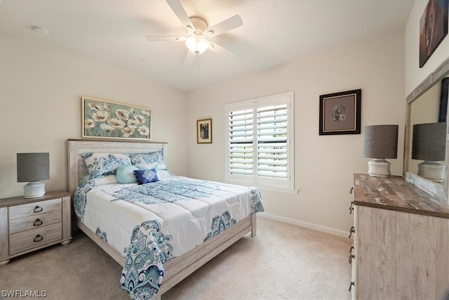 bedroom featuring light carpet and ceiling fan