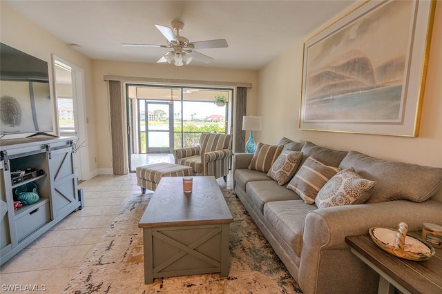 living room featuring light tile patterned floors and ceiling fan