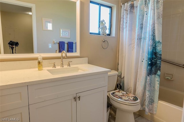 full bathroom with shower / tub combo with curtain, vanity, tile patterned flooring, and toilet