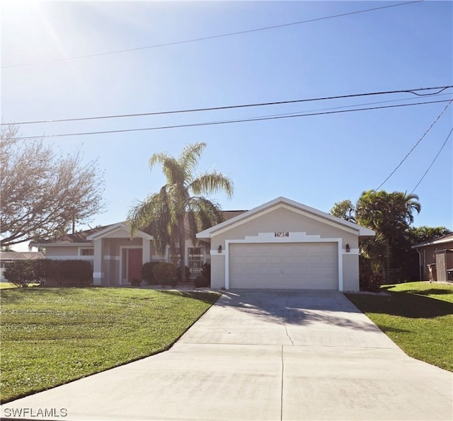 view of front of house featuring a front yard and a garage